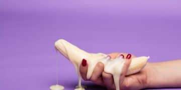 white ceramic figurine on purple surface