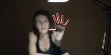 woman in black tank top raising her hands