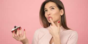 woman holding cake looking up